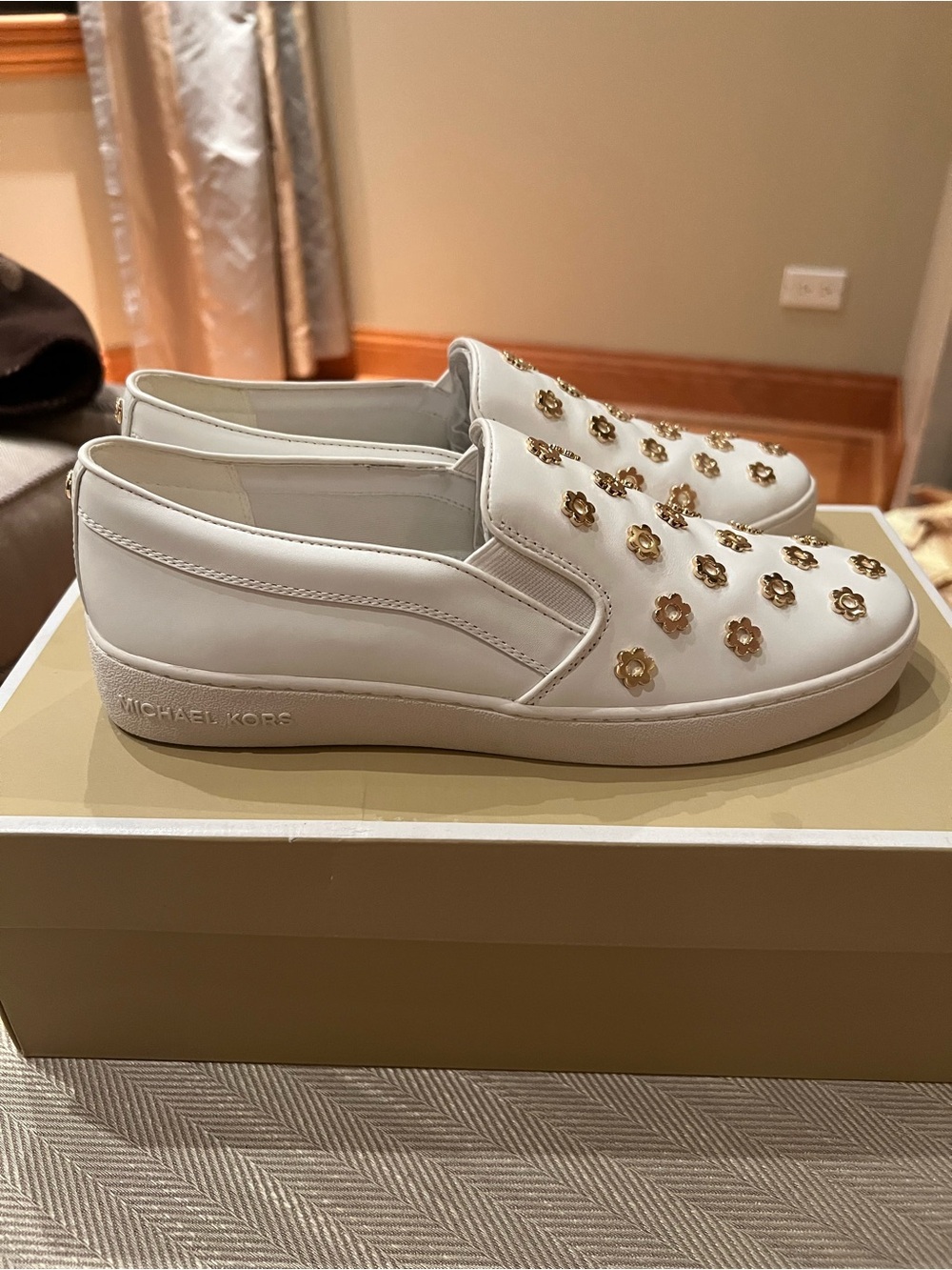 NYT Michael Kors white leather slip-ons